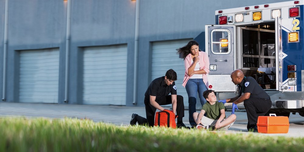 EMS helping child and mom - horizontal