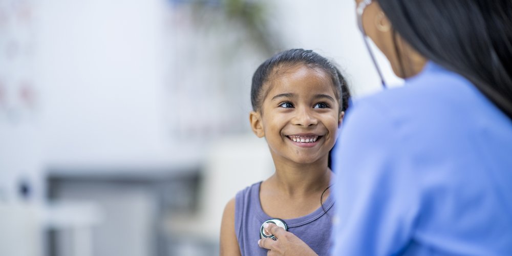 Child smiling at nurse