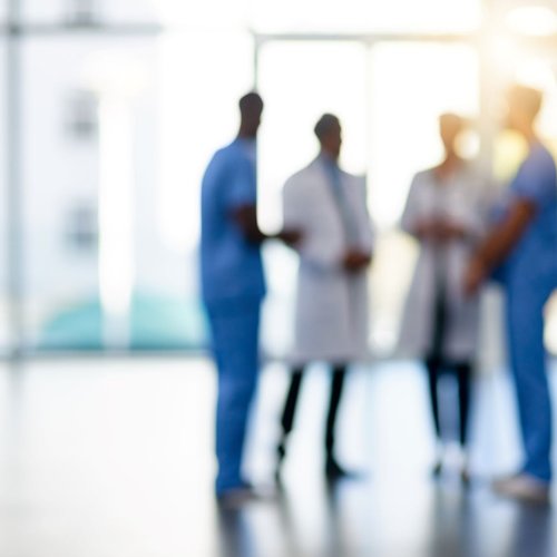 Clinicians talking in lobby
