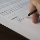 hand signing a proclamation