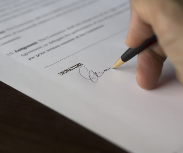 hand signing a proclamation
